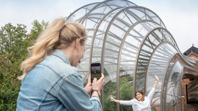 Women taking photos outside Bombay Sapphire Distillery