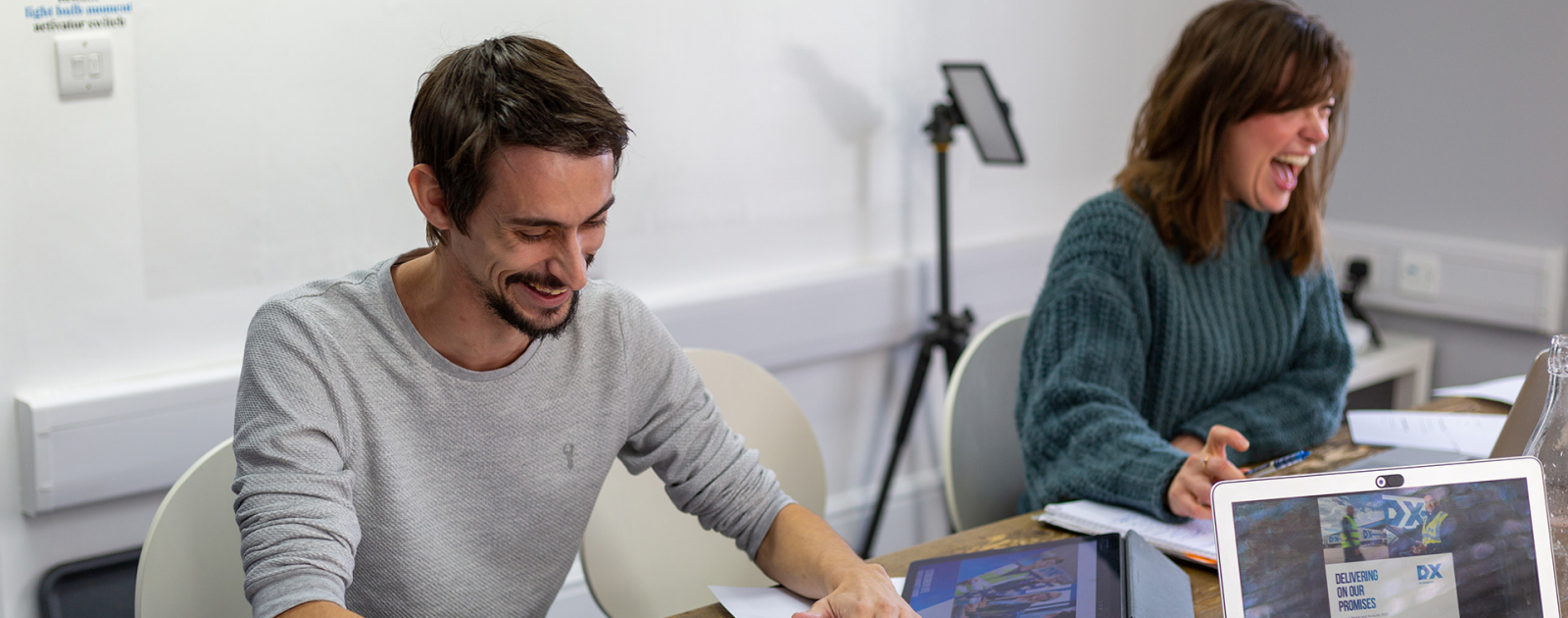 Man smiling in board meeting